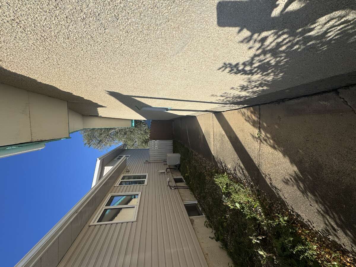 Side of House Looking Towards Backyard Entrance