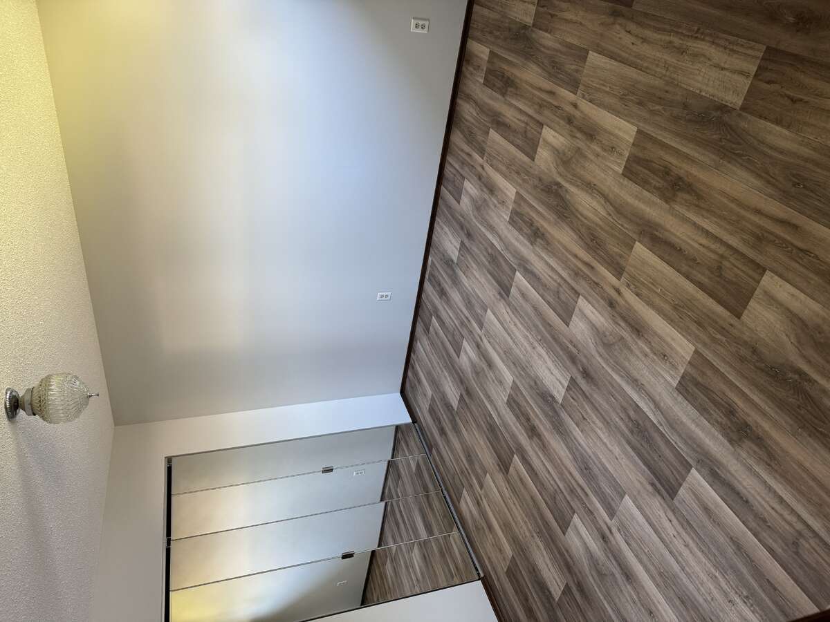 Master Bedroom Looking towards Mirrored Closet Space
