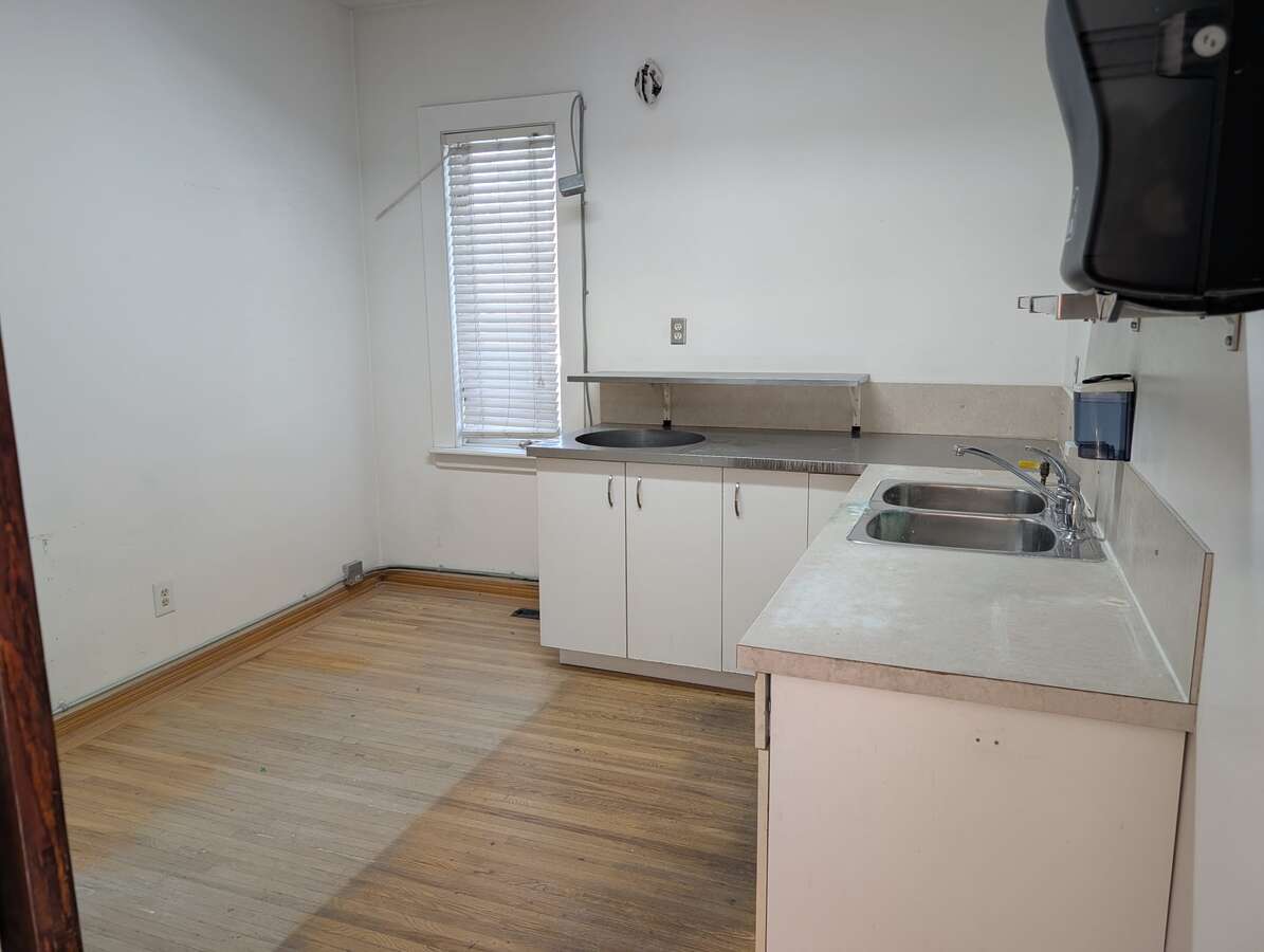 East bedroom with commercial counters and sink