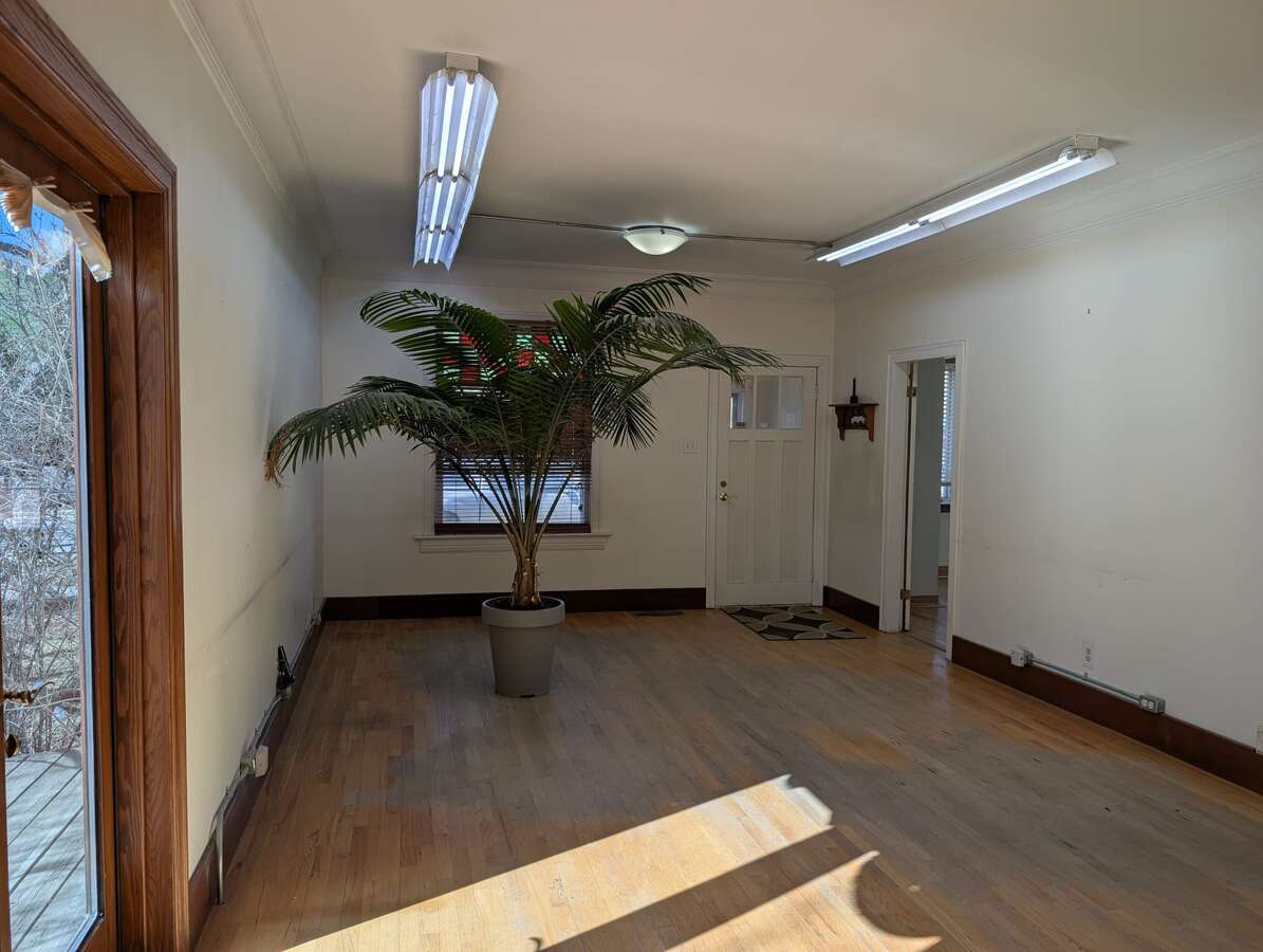 Living Room with commercial lighting and hardwood floors