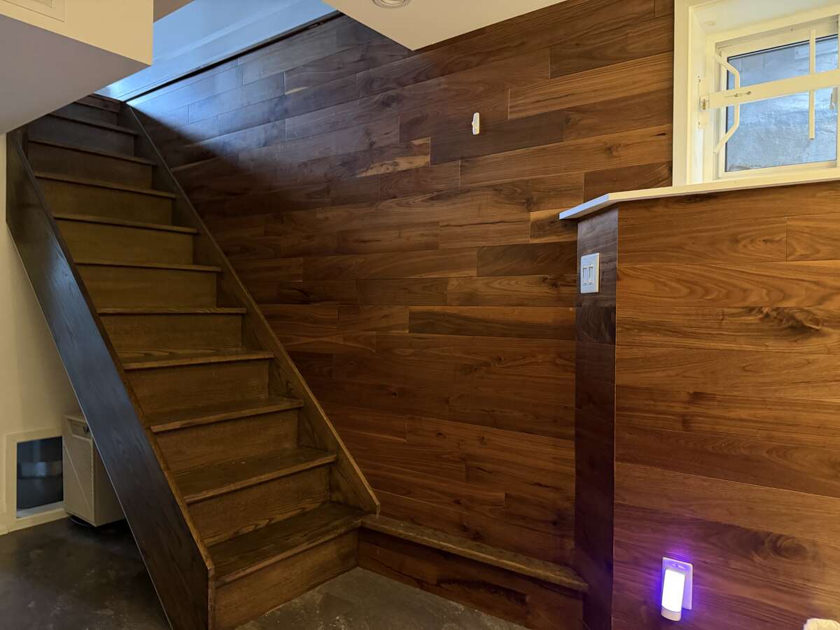 Walnut wall along basement stairs