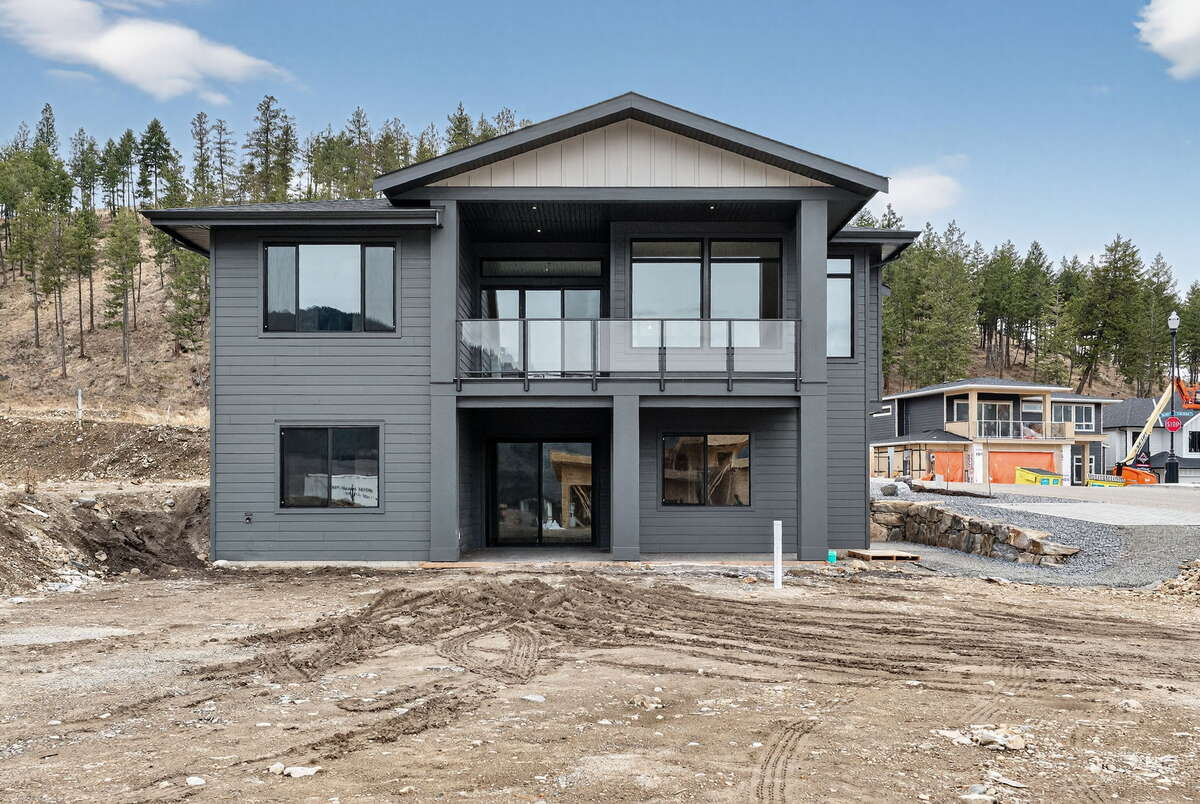 Original design rendering of finished home with landscaping