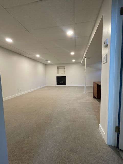 basement rec room with gas fireplace