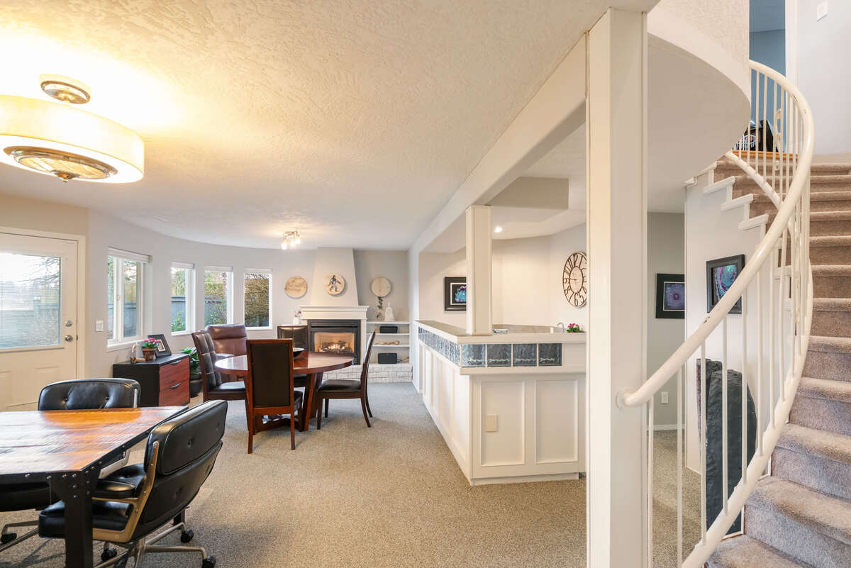 Open curved staircase down to the spacious walk out basement
