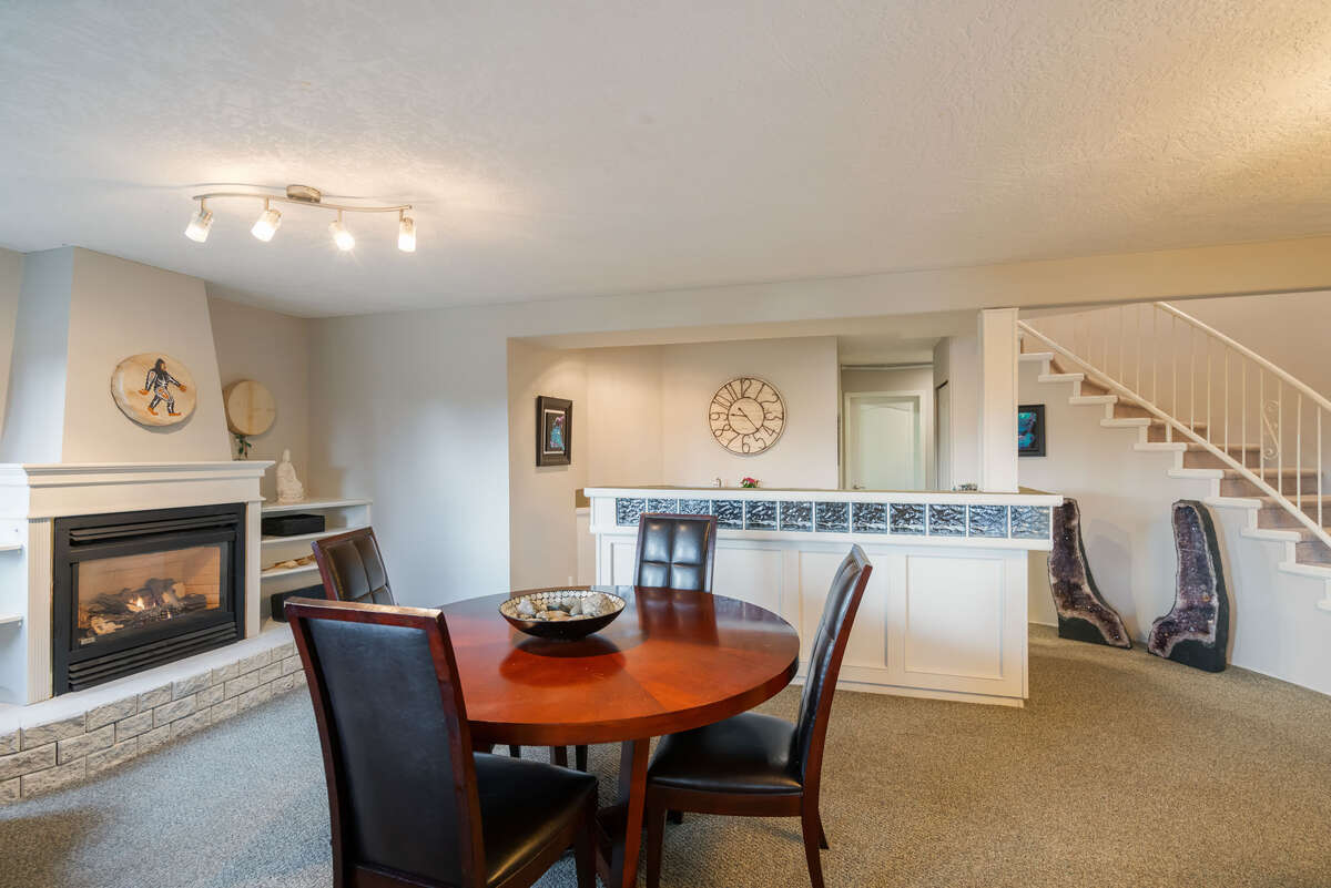 Wet bar and cozy gas fireplace.