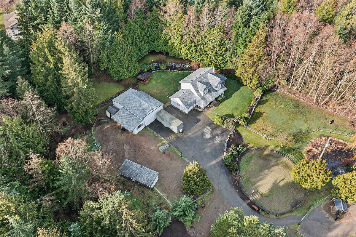 Ariel view of house/shop/coops/storage/barn and 60' riding ring.