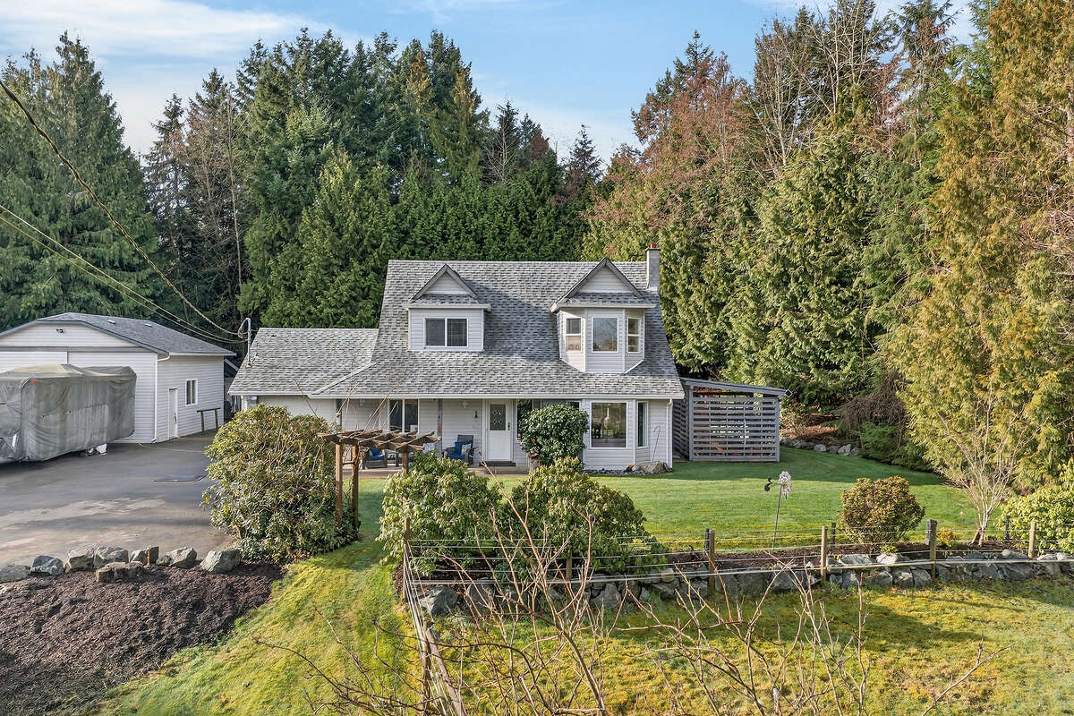 Front yard, gardens, wood shed & fenced in upper pasture.