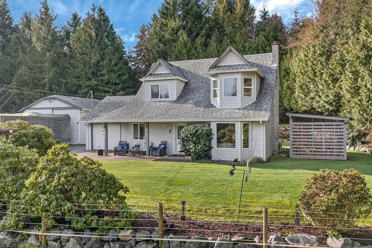 Front of Cape Cod home/workshop and wood shed.