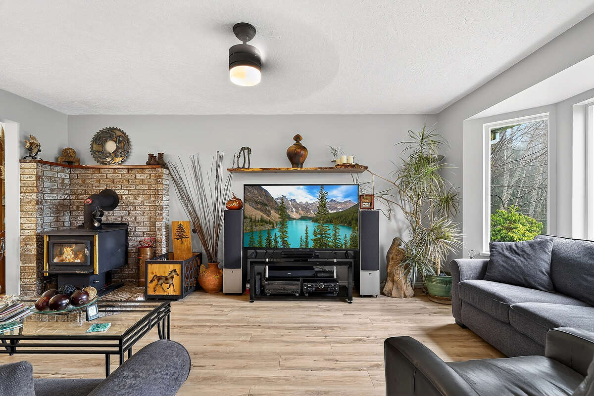 Sitting area to enjoy the low maintenance gardens and views of pond &  front pasture.