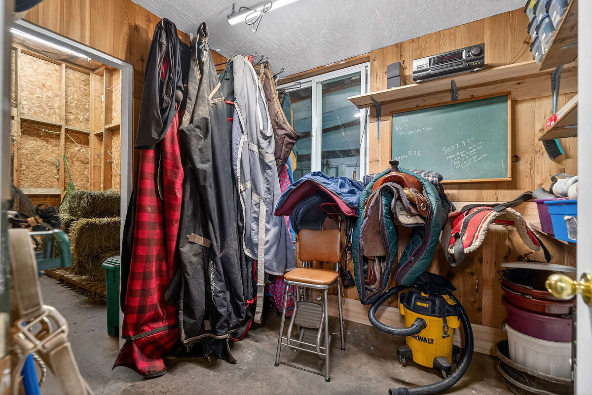 Tack room looking into separate dry feed and hay storage room.