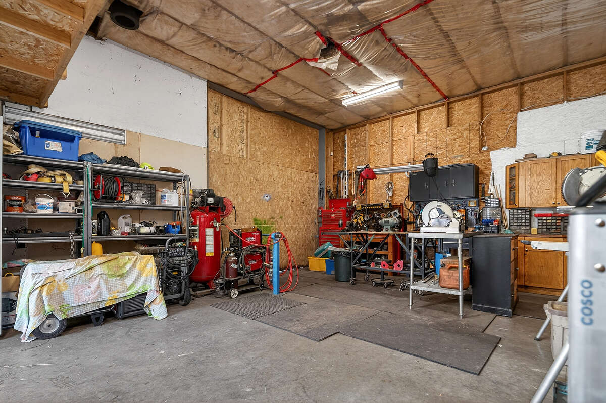 Shop with large access door and 12 foot ceilings, great for equipment, RV, etc.