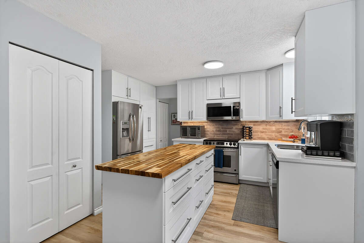 New Kitchen in 2025 featuring stainless steel appliances. Plenty of storage & two pantries.