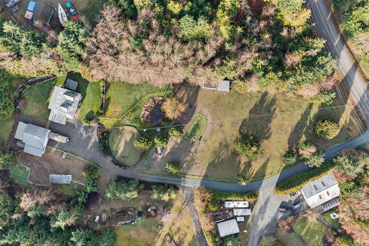 Ariel view of house/shop/coops/storage/barn and 60' riding ring.