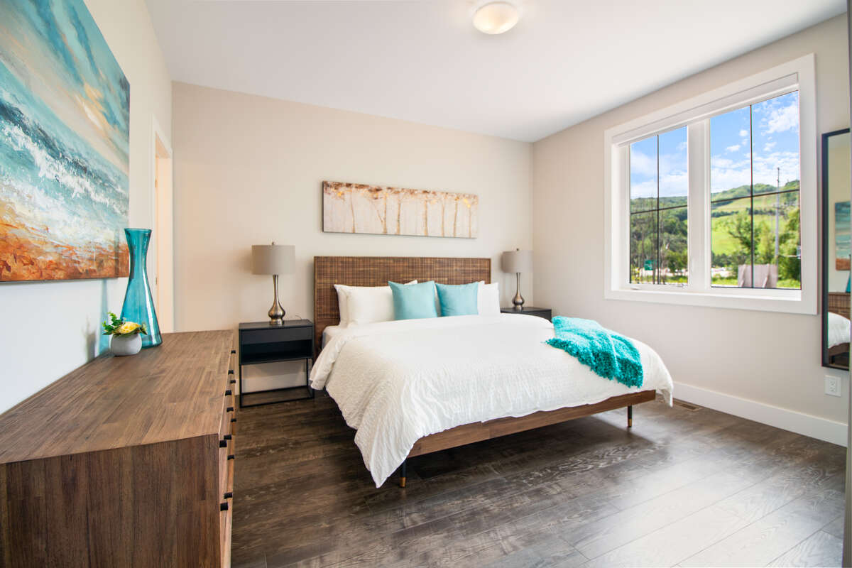 Master Bedroom Queen Bed with ensuite bathroom  - main floor back left of house