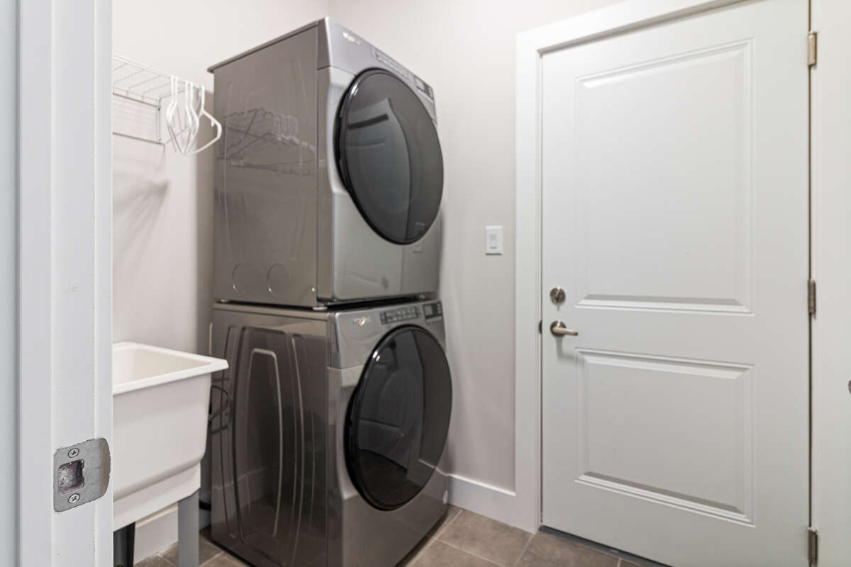 Laundry room 1/2 flight down stairs from main floor - door to Garage