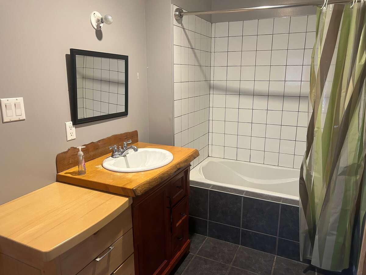Newly Tiled bathroom with live edge vanity