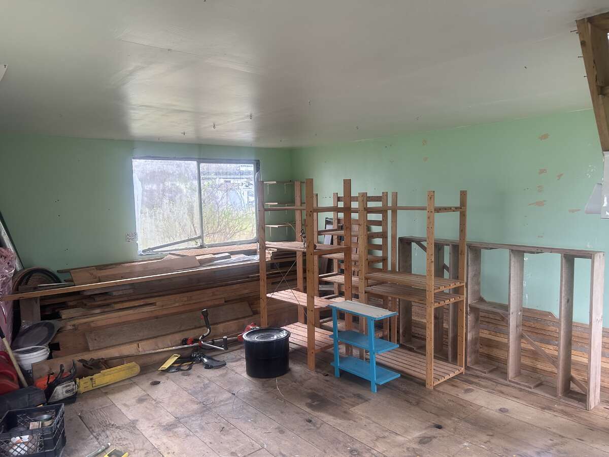 Lumber, construction materials, and several tools can be included.