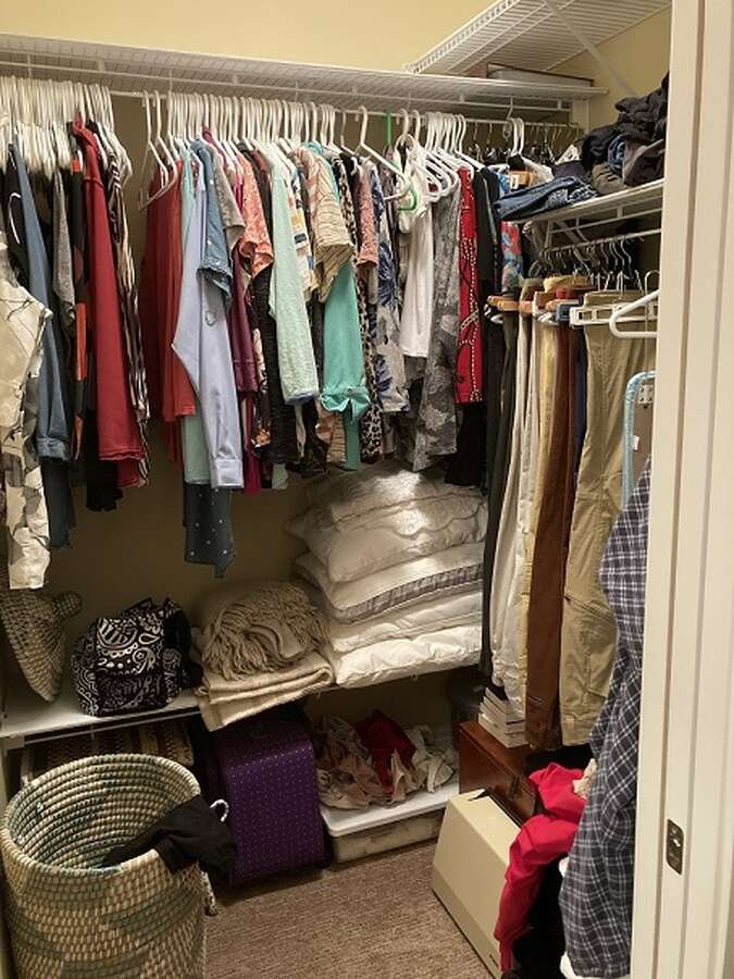 master bedroom walk-in closet with sliding door