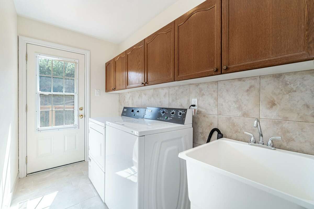 Main Floor Laundry Room with Walkout to Deck and Clothesline