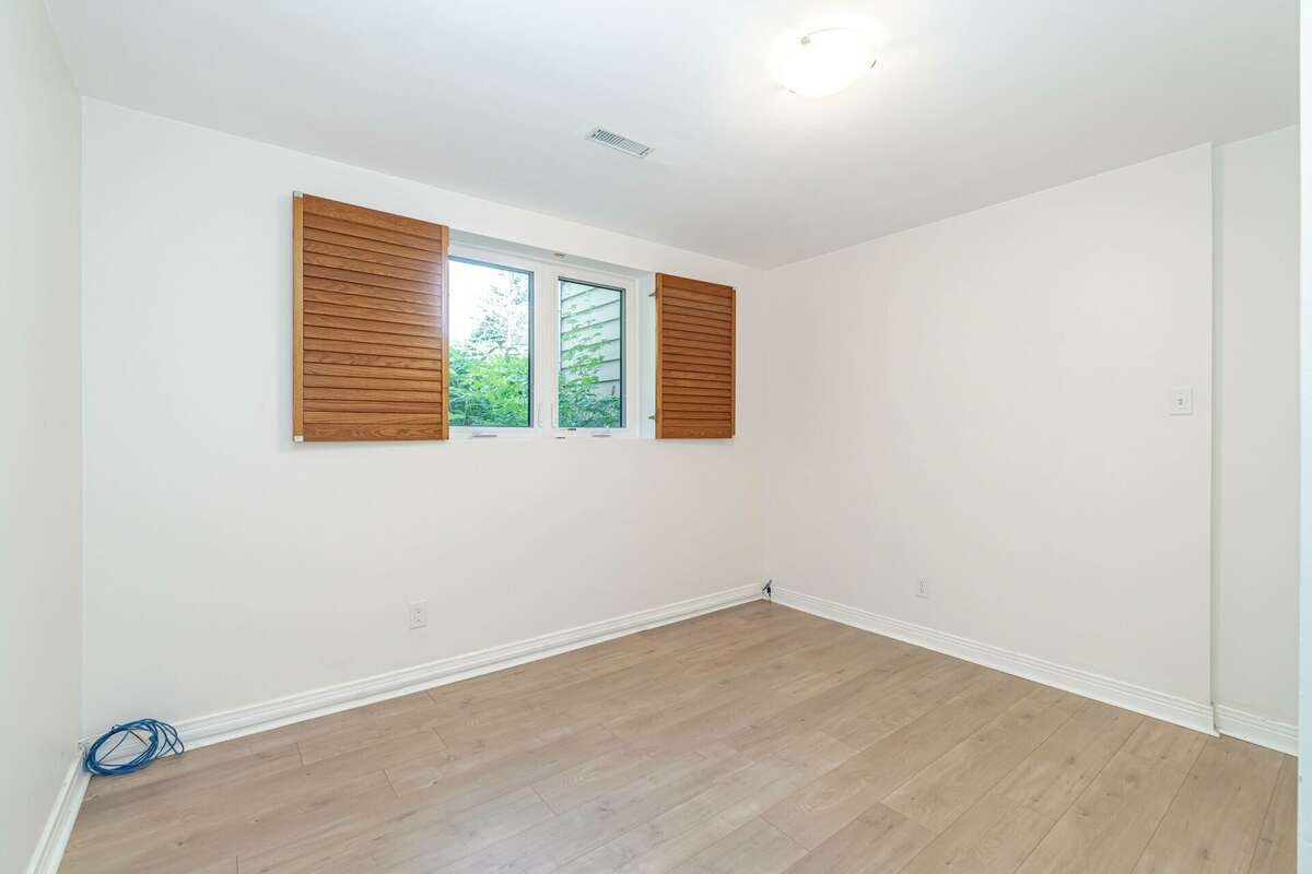 Downstairs Bedroom with Laminate Flooring