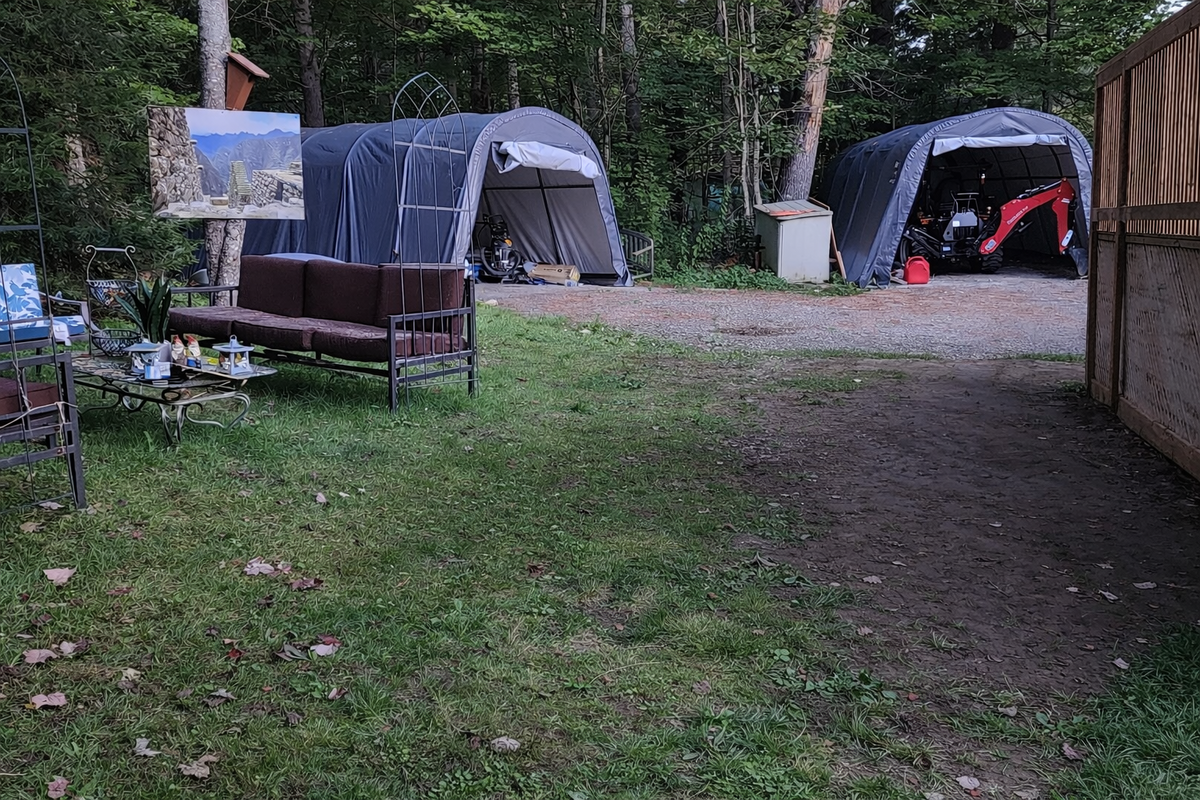 We now have a privacy fence dividing the back yard from the 3 large shelters.