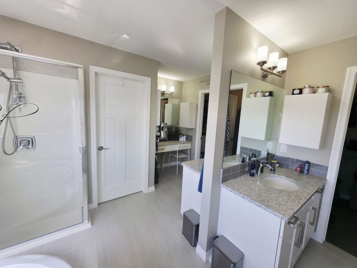 UPPER LEVEL - PRIMARY BATHROOM WITH PRIVATE TOILET AREA