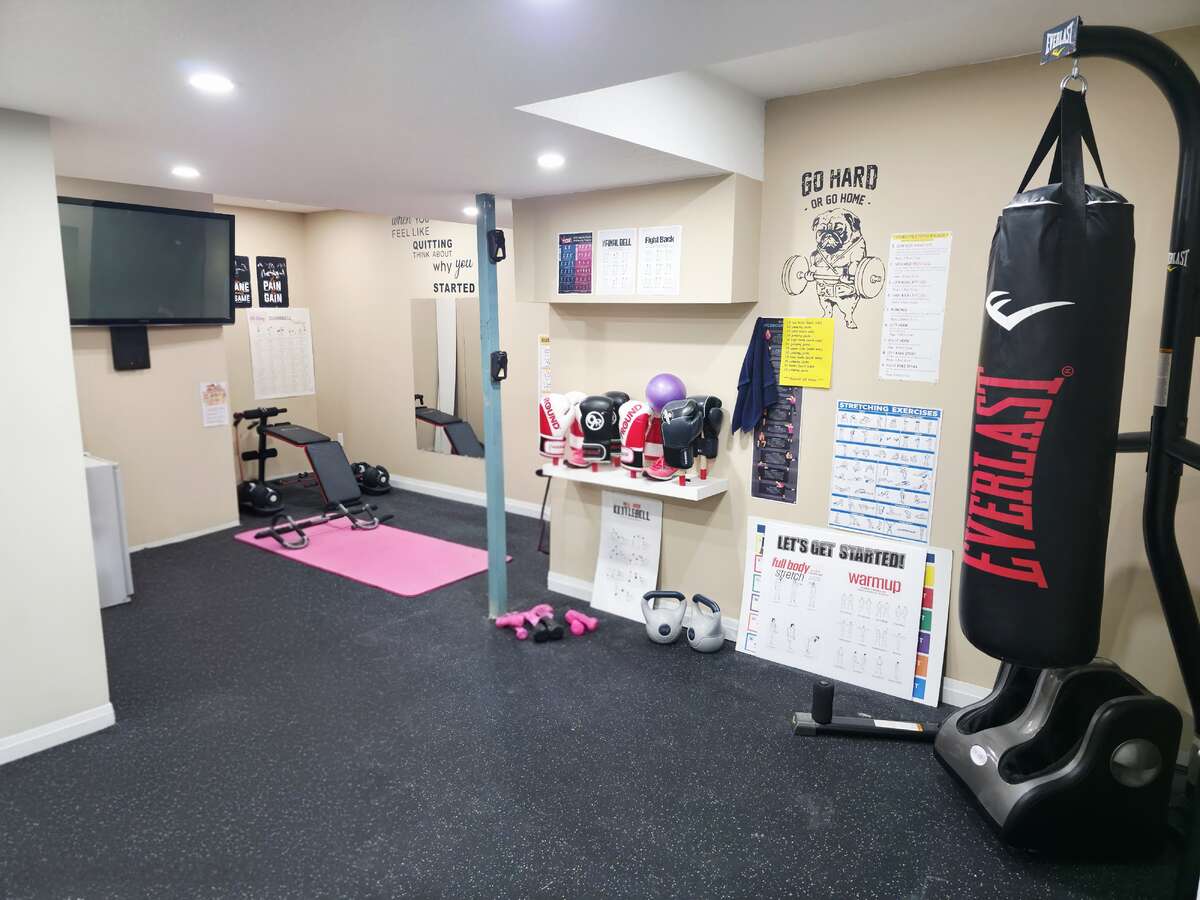 LOWER LEVEL - GYM WITH PROFESSIONAL GYM RUBBER FLOORING