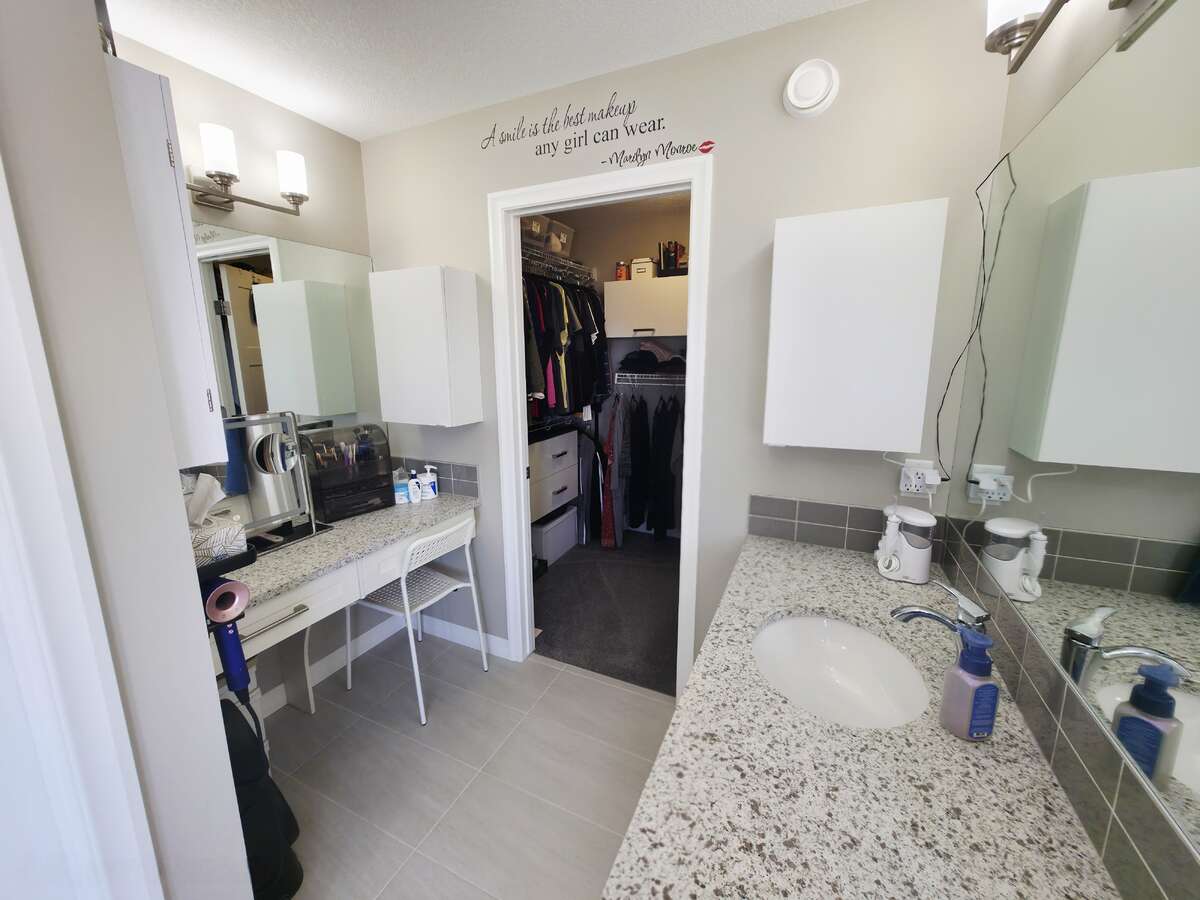 UPPER LEVEL - PRIMARY BATHROOM - HER SIDE SINK & WALK-IN CLOSET