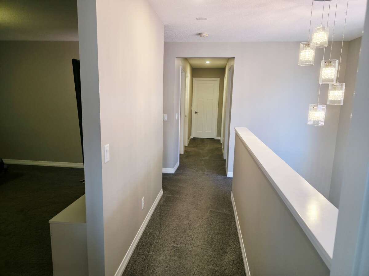 UPPER LEVEL - HALLWAY OVERLOOKS PART OF MAIN FLOOR