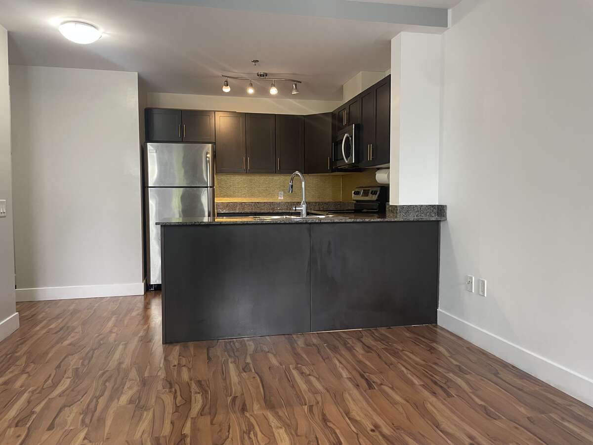 11'3"x9'2" kitchen, south facing view from foyer showing bar seating area
