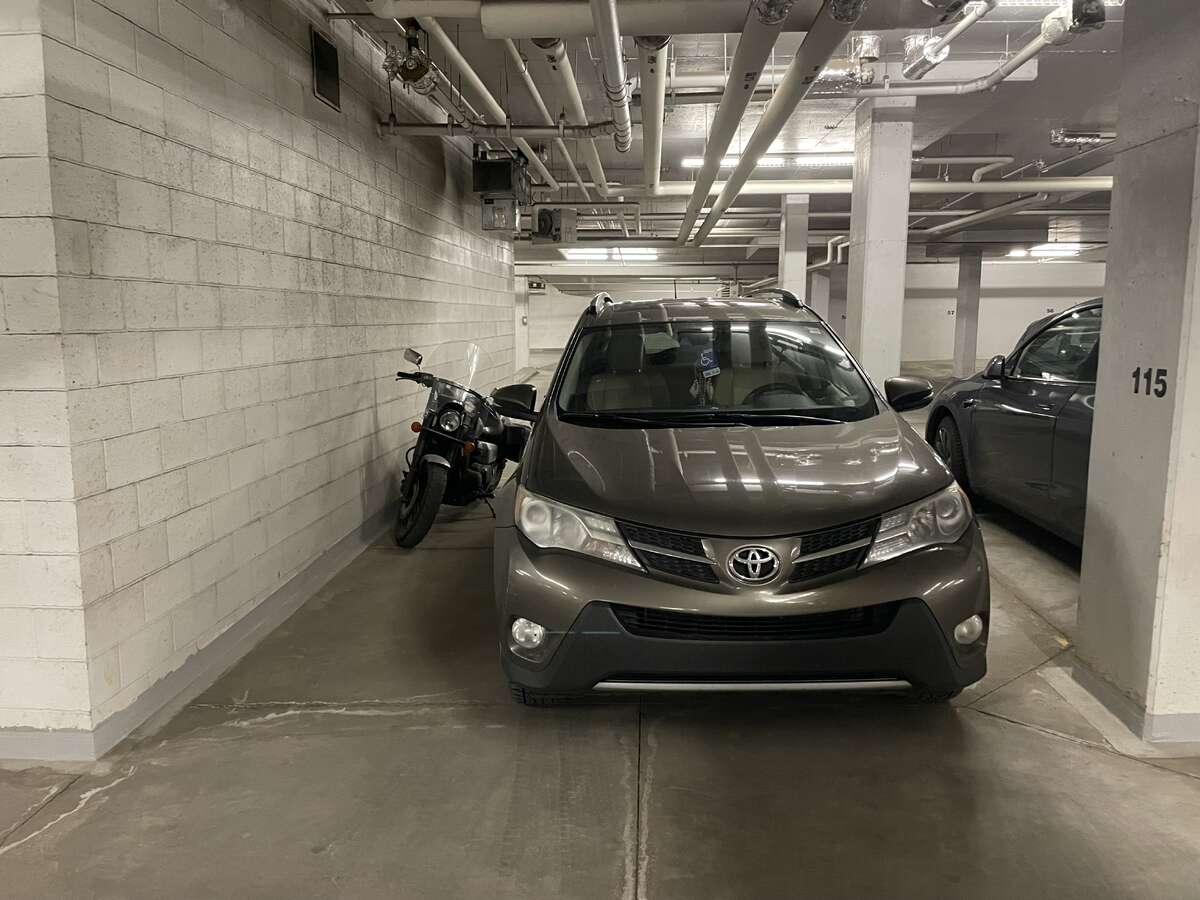 Extra wide  (158" vs 103") parking stall located next to the elevators
