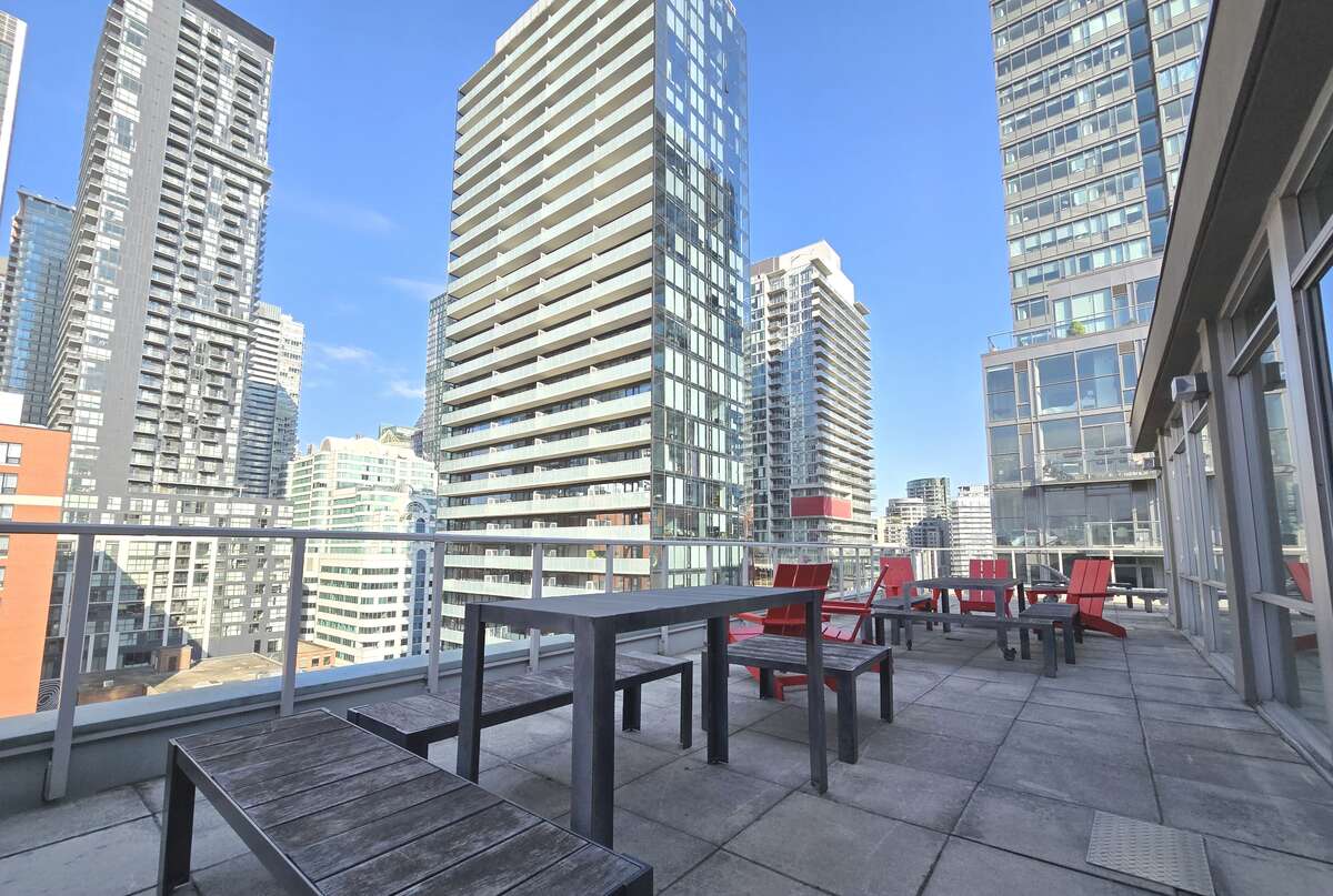 Enjoy the serene city views from the spacious rooftop patio, perfect for relaxing or entertaining.