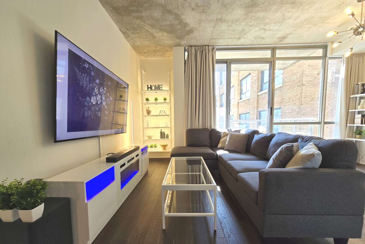Open concept living area with large windows and modern fixtures.