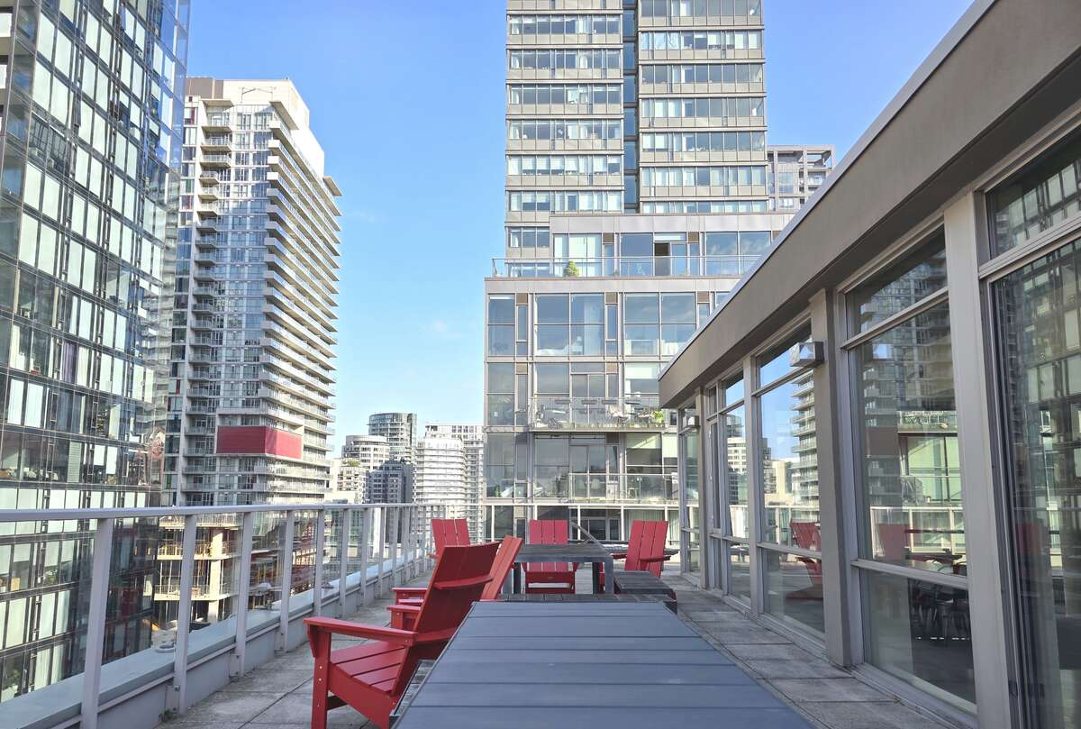 Unwind on the quiet rooftop with ample seating, ideal for gatherings and enjoying the downtown skyline.