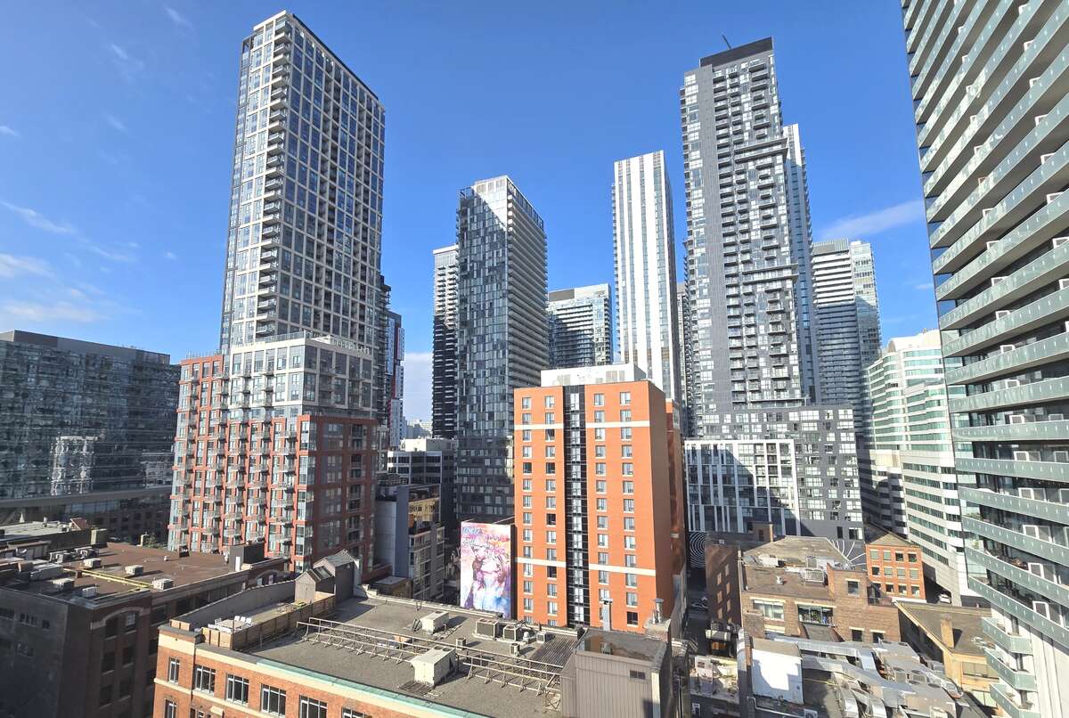 Experience the urban vibe with stunning views of Toronto's architectural marvels from the rooftop terrace.