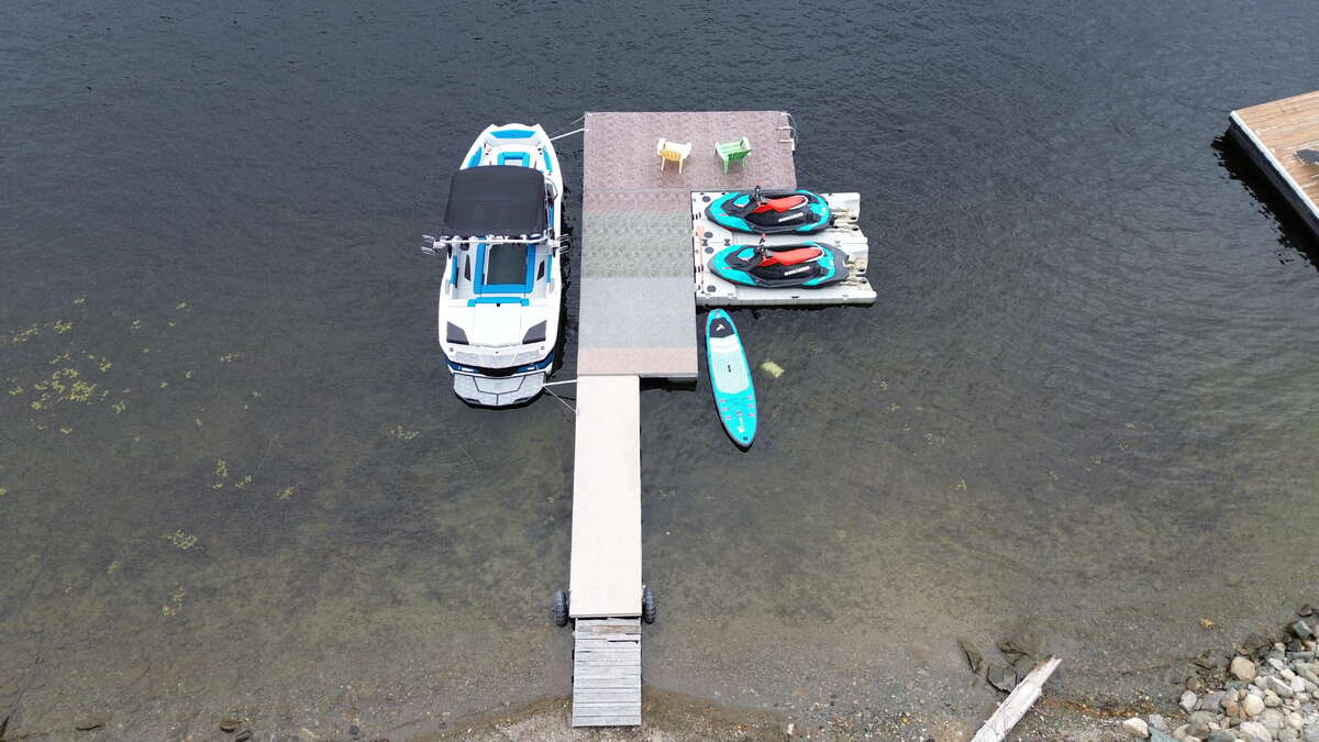 Boat and watercraft shown are available separately / not included in asking price.
