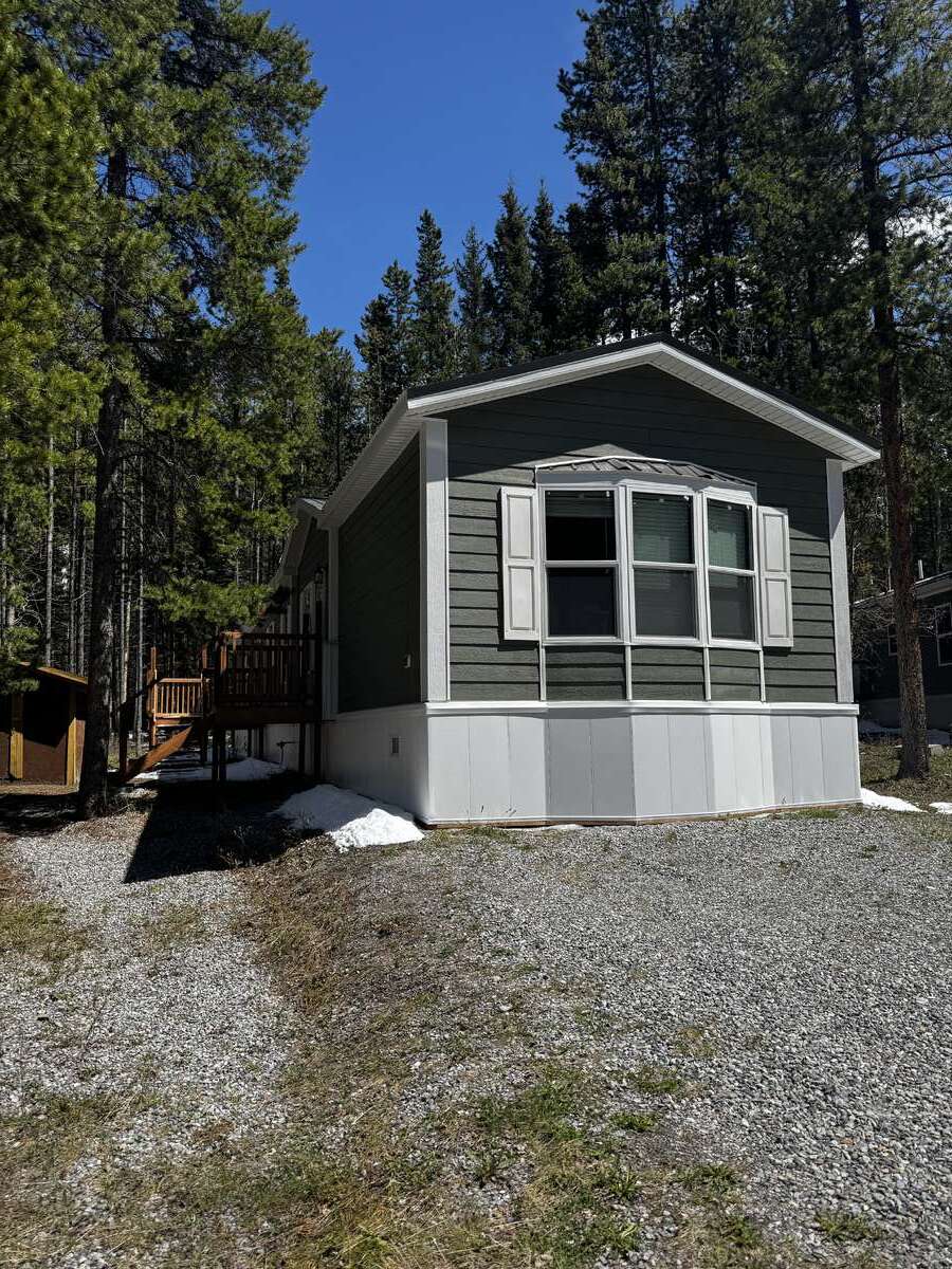 Beautiful Green home exterior - Cement Fire Proof Siding and Metal Roof