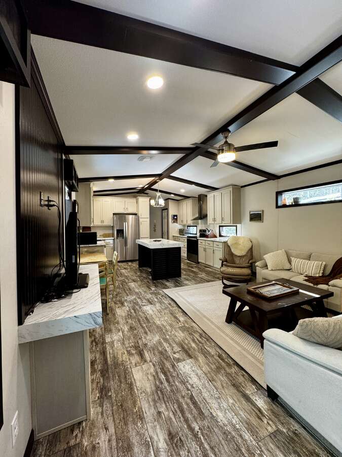 view of living room and kitchen from door