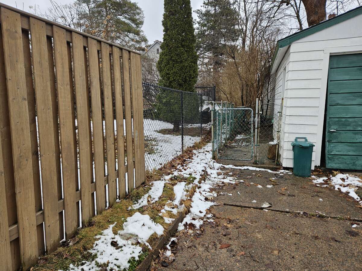 Dog Kennel Alongside Garage