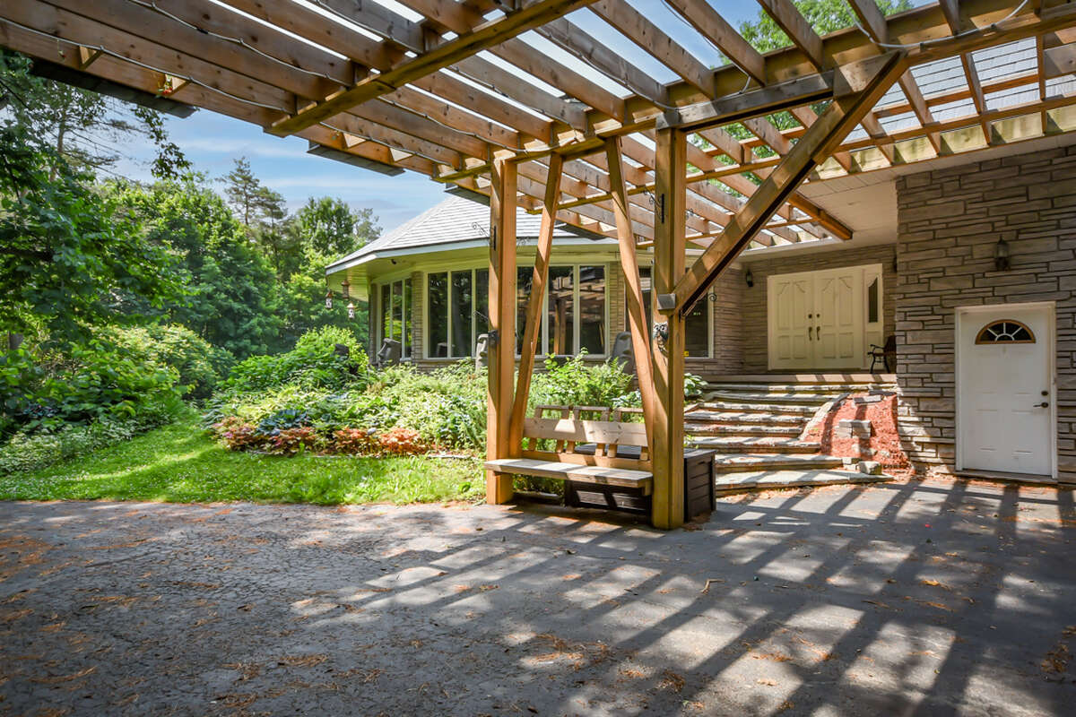 Exterior front entrance with pergola