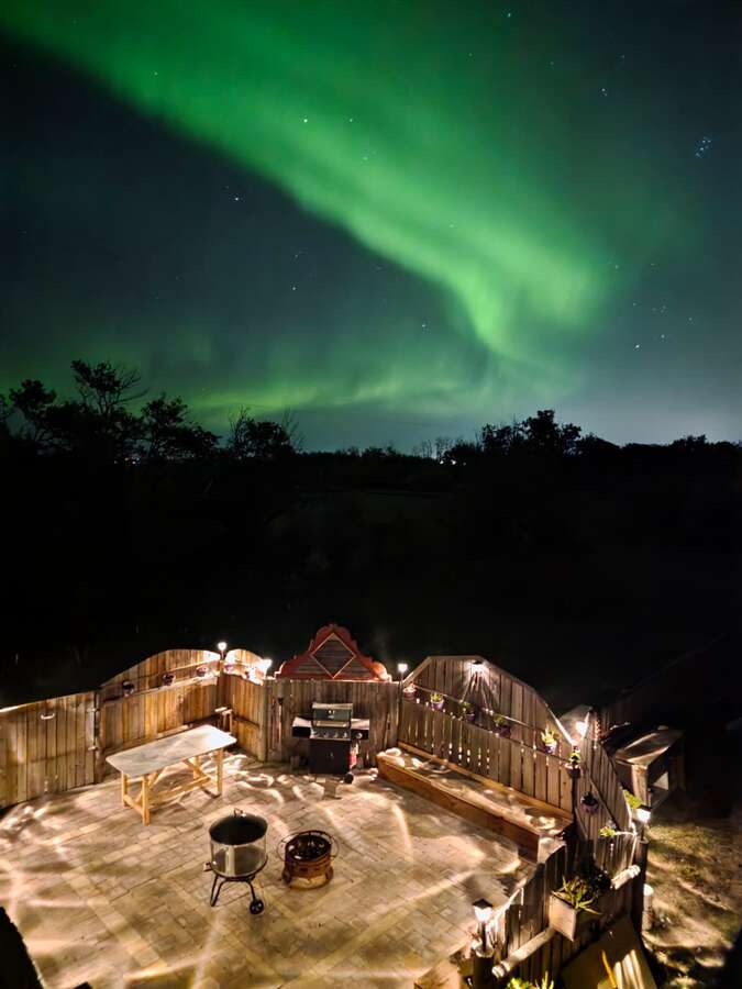 Northern Lights over Outdoor Fireplace