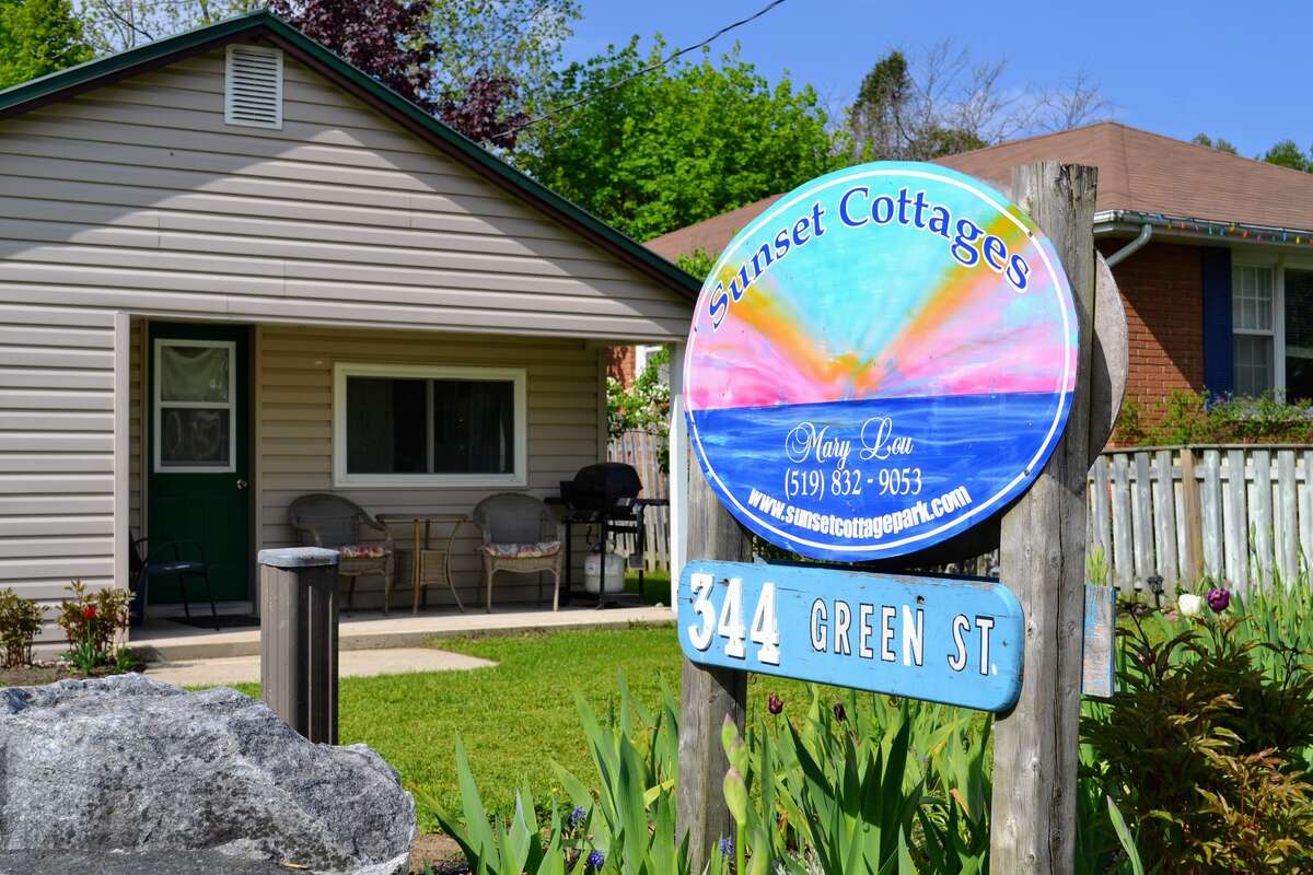 Mill Road Corner – Cozy 2-bedroom cottage with covered front porch and sunset views.