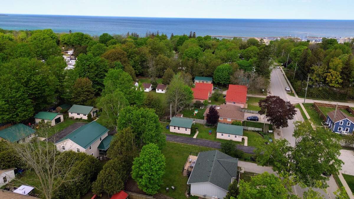 Mill Road Corner – Cozy 2-bedroom cottage with covered front porch and sunset views.
