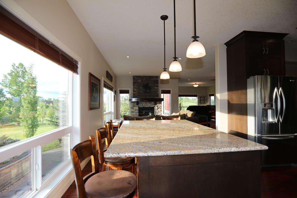 Kitchen island with full cabinets with a full view of the outside
