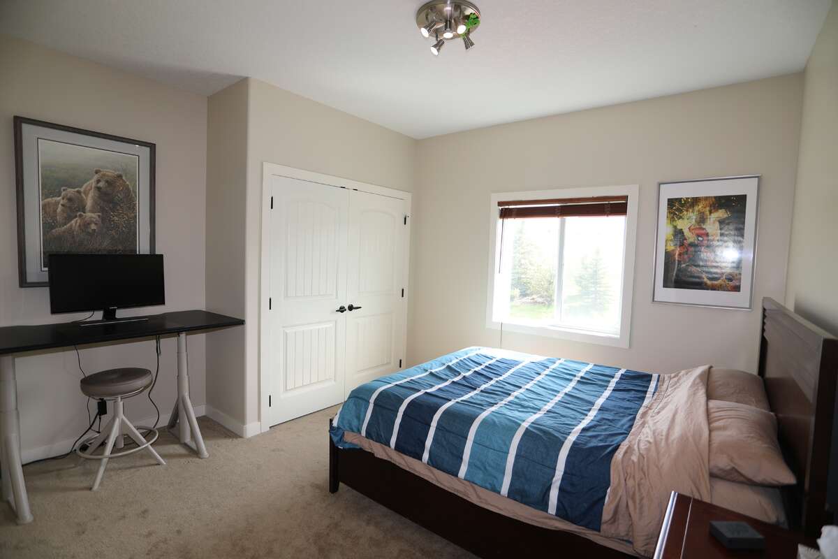 First Bedroom on the left of the hallway, backyard view of the house