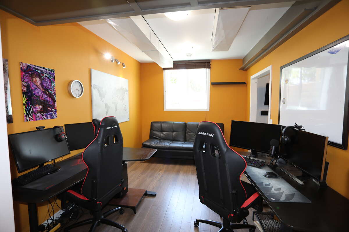Computer and study office beside exercise room