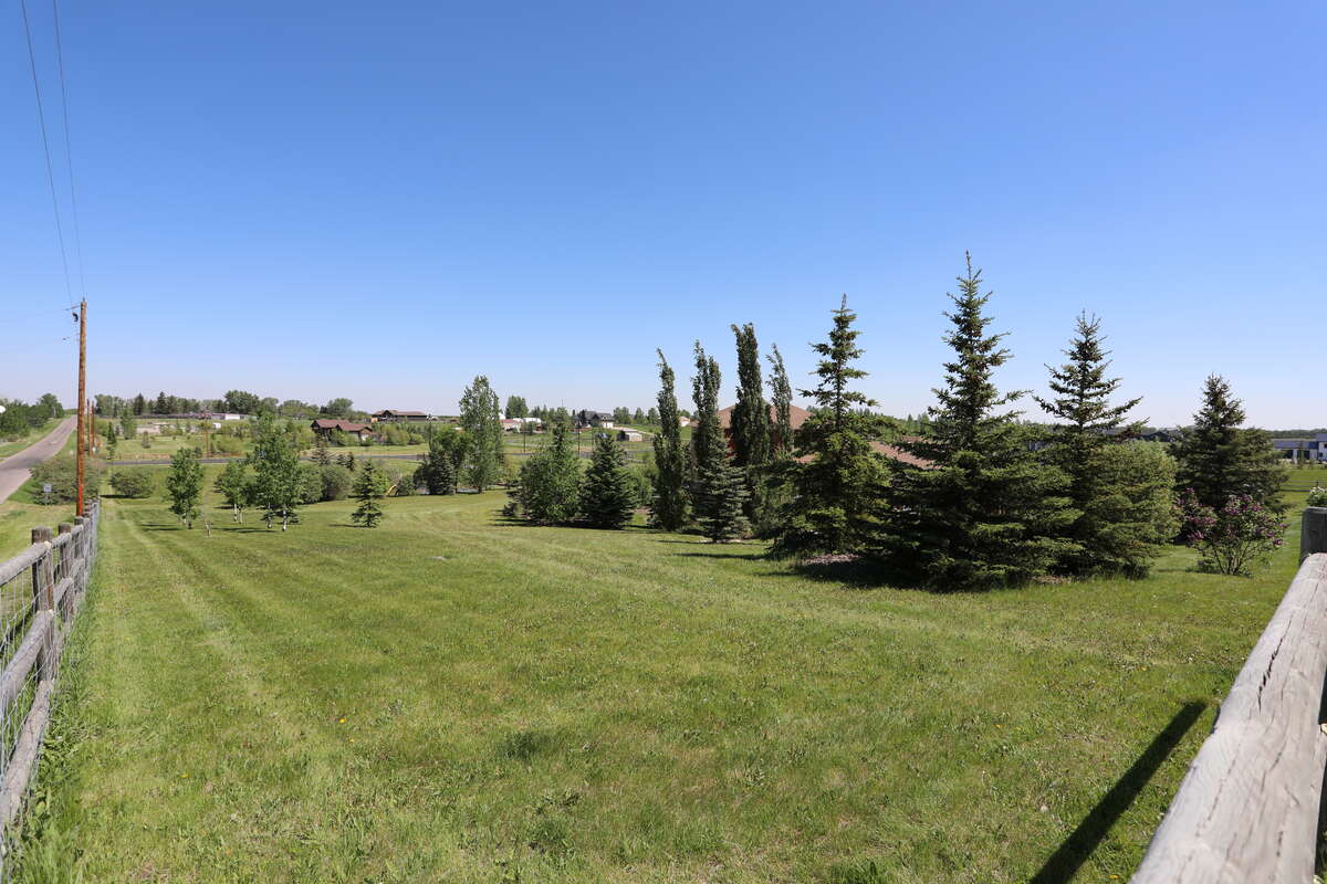 View of house's landscaping from road, excellent tobogganing hill