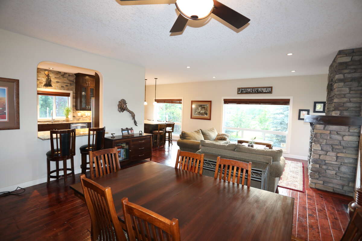 Main dining area and living space with gas fireplace