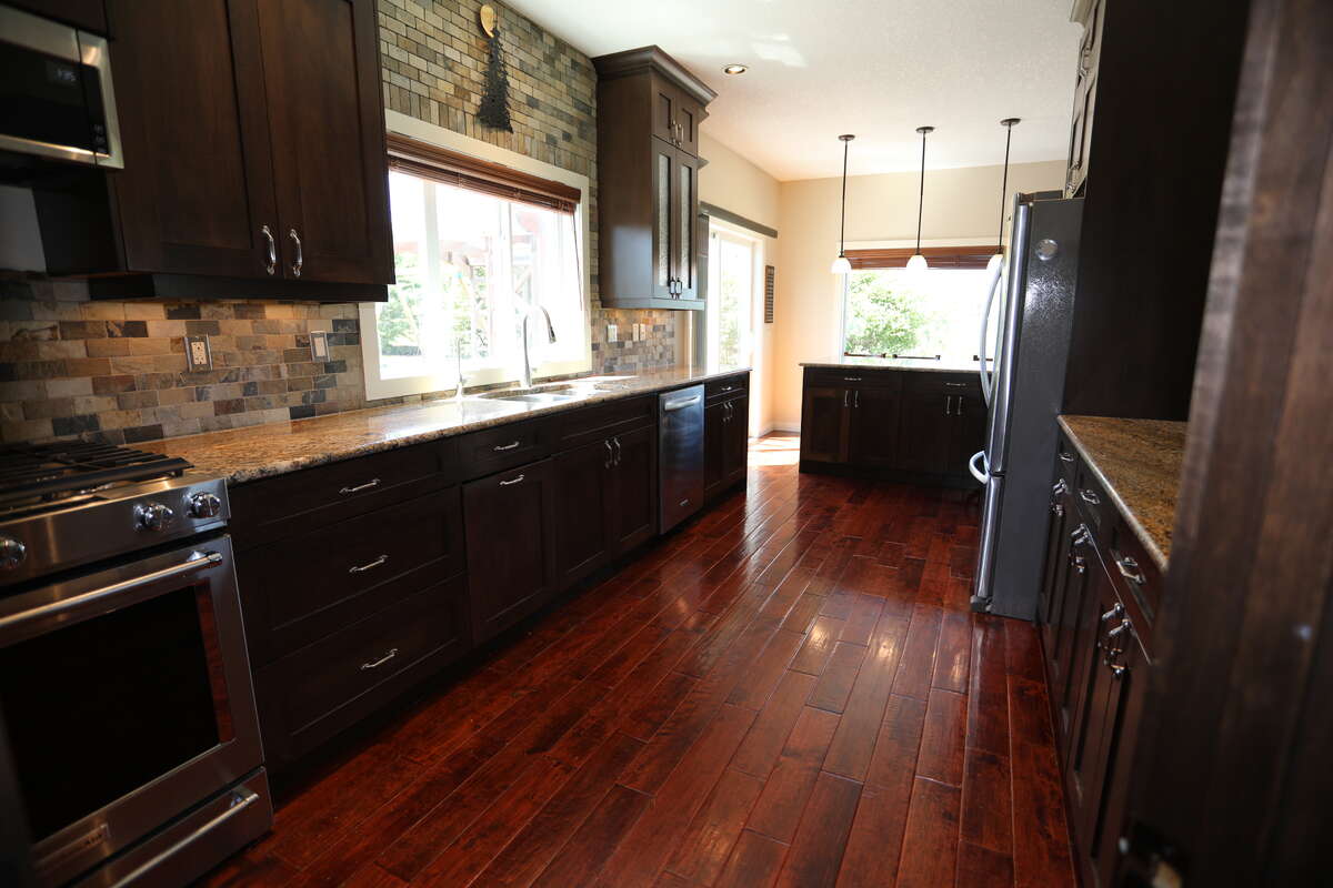 Dual-Oven Gas, Microwave, Fridge, Dual-Sinks with Garburator, and R.O. water