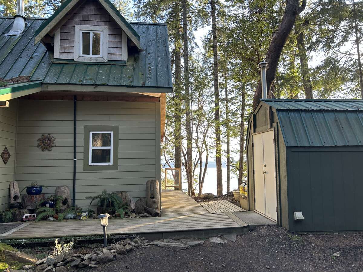 Utility shed for generator, batteries, converter, on demand hot water, and washer/dryer.